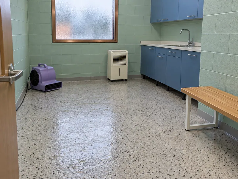 Water Extraction in Schertz, TX — drying equipment in a damp staff break room